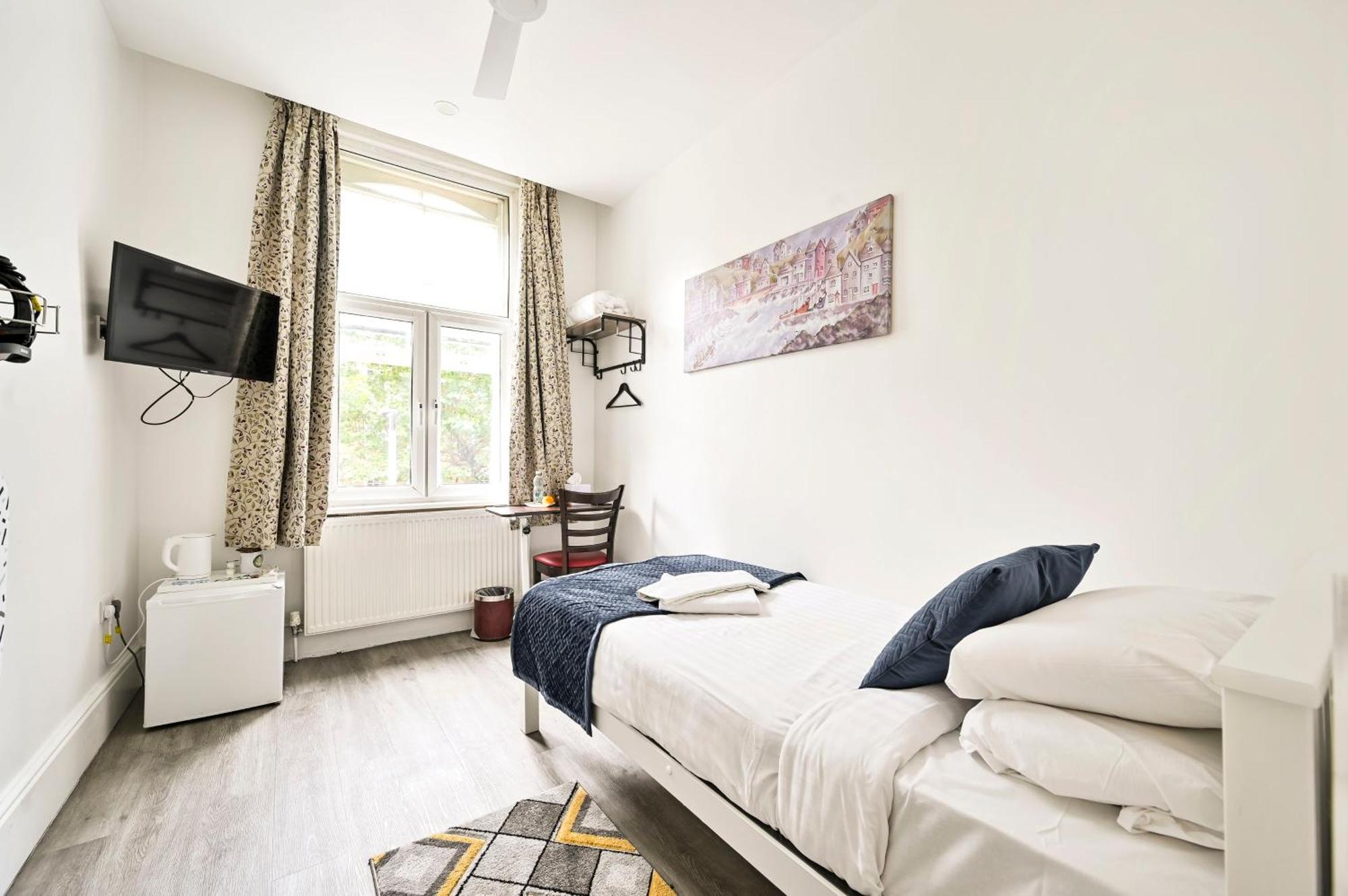 Camera Singola con Bagno in Comune