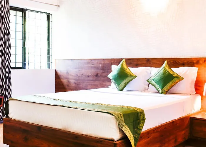 Treebo Comforts Inn, University Road Deralakatte
