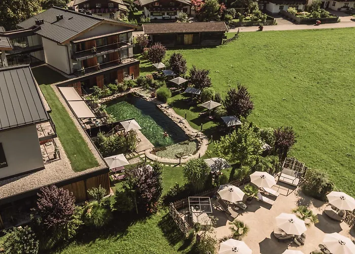 Wellness und Brunch Hotel MorgenZeit beheizter Naturteich Genuss Frühstück bis 13 Uhr Hochkönig Sommercard